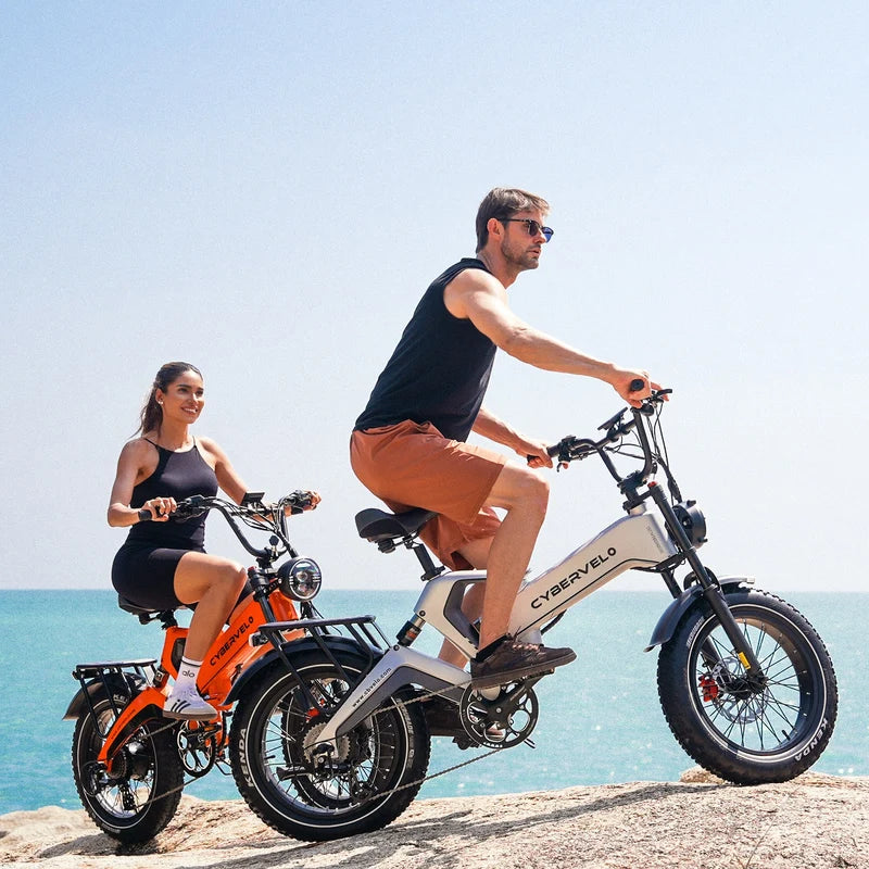 Folding fat-tyre electric bike riding along a dusty trail